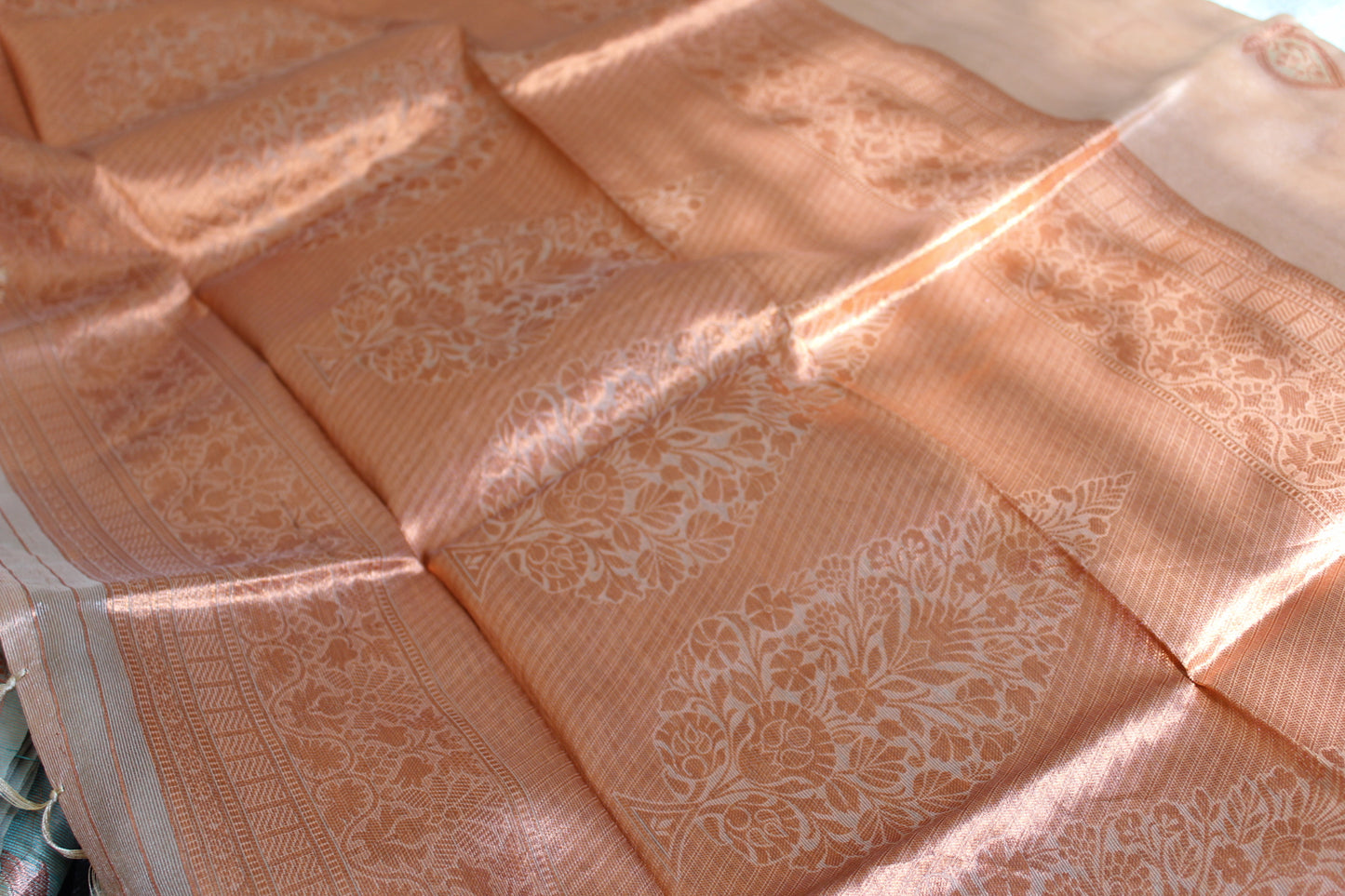 Naive Peach Tissue Organza Saree with Copper Motifs